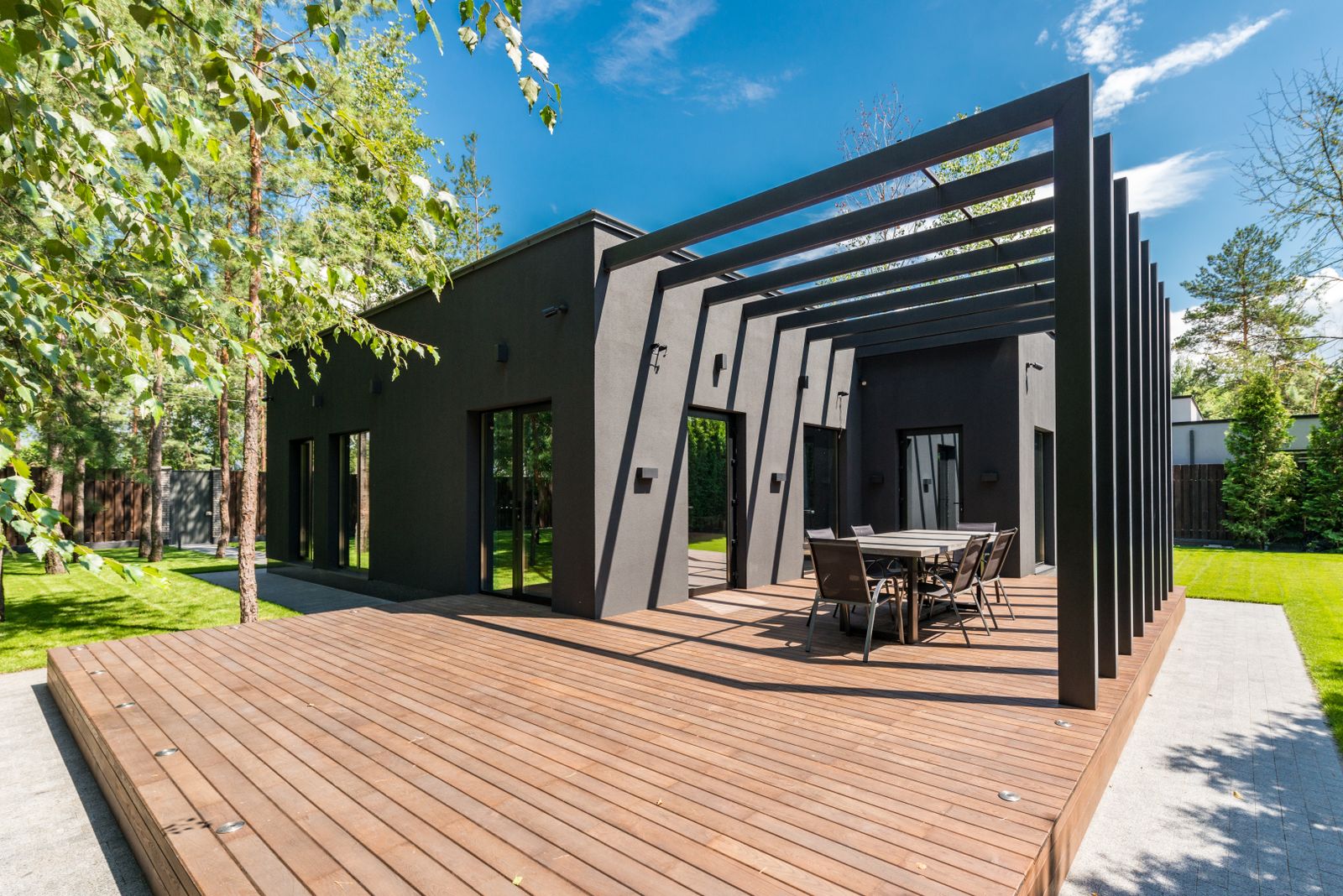Backyard deck with pergola and outdoor dining area